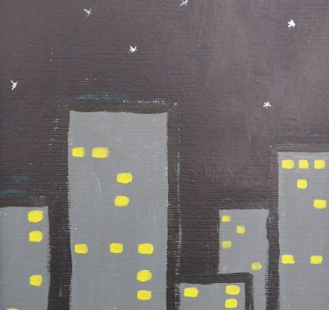 Grey skyscrapers with yellow lit windows, in front of a black sky with stars