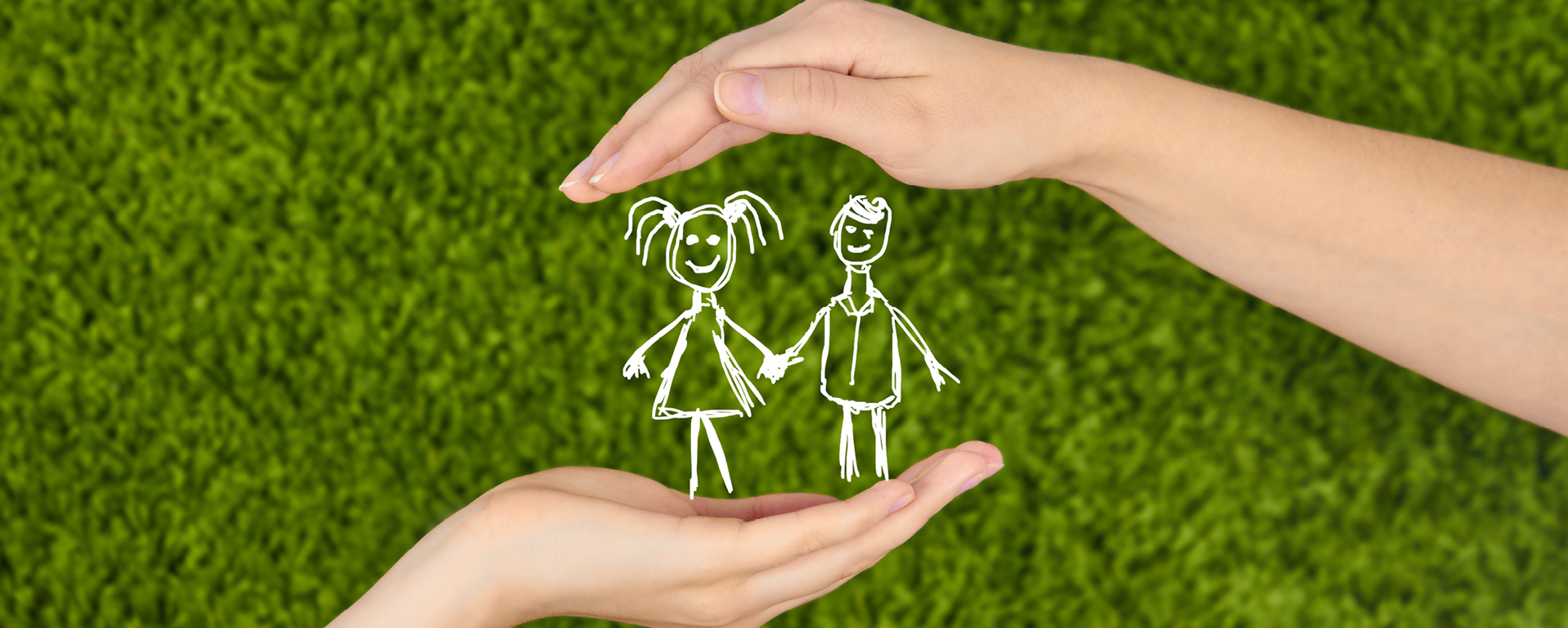 Image of hands around a stick figure drawing of children