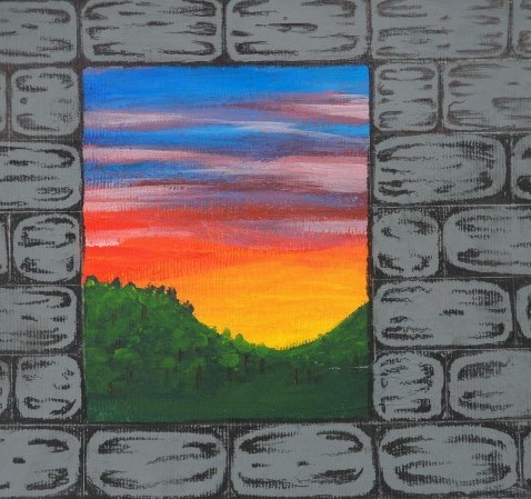View through a window of a stone wall, of a colourful sunset and green hills