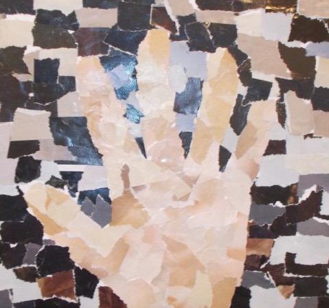 Paper mosaic of a hand against a black and white background