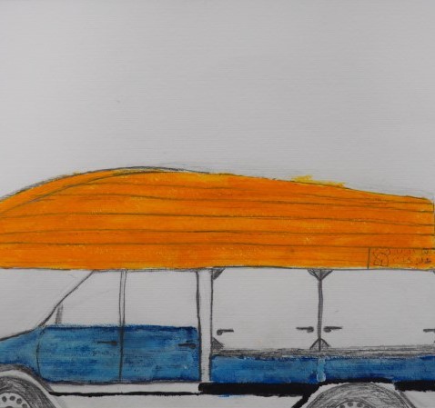 A yellow wooden boat being carried on top of a blue ute